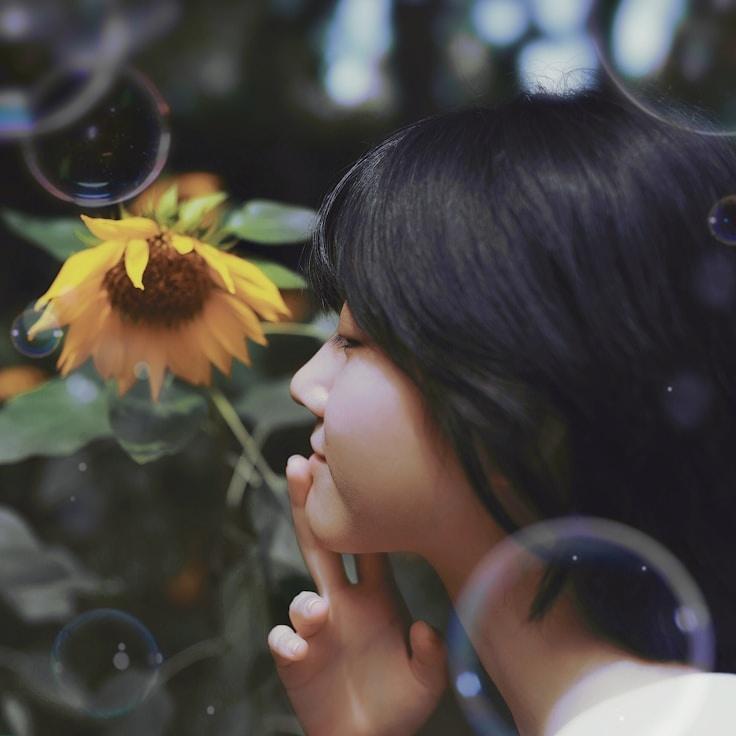 Kaveri Mehta, Lead Design Curator at EchoAtlasPlume, reviewing corporate floral arrangements